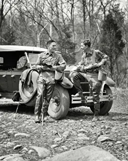 Rewarding: Two Well Equipped Fly Fishermen Talking Sitting