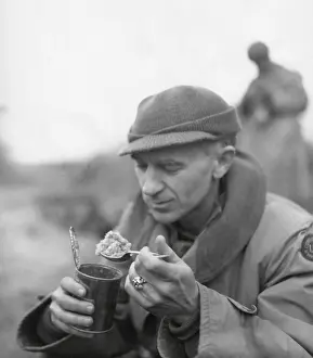Beachhead: Ernie Pyle, war correspondent, eating his C