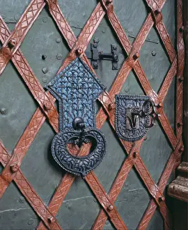 1487: Escutcheon and pull ring at the sacristy door of?