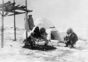 Igloo: Eskimos from Greenland in front of an igloo
