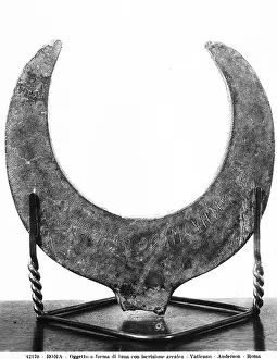 Gregorian: Etruscan moon-shaped object with an