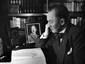 Bookshelf: Eugen Rex at his desk, 1930s