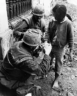 Rescans: EV1949 - Two U.S. Marines apply bandages ?