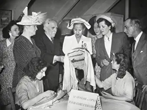 Seamstresses: Eva Peron visiting a sewing workshop where women