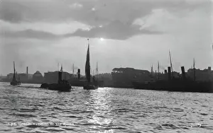 Peeking: Evening on the River Thames, London