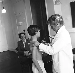 Stethoscope: EXAMINING A PUPIL/1958