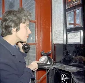 Booths: Example of a woman dialling 999