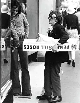 Engaging: Excentric man with paper flowers and roses