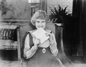 Correspond: Excited woman with letter