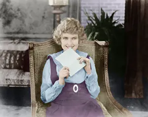 Excite: Excited woman with letter