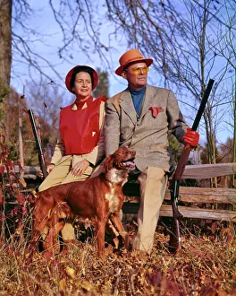 Shotguns: Experienced Couple Dressed For Upland Game Bird