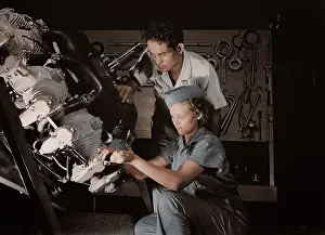 Supervisor: An expert mechanic shows a student the tricks