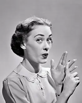 Adamant: Expressive Woman Pursed Lips Raised Eyebrows looking