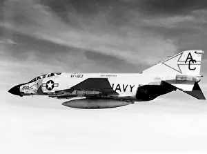 Warplane: An F-4J Phantom fighter aircraft flying over