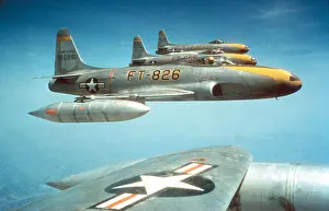 Fighter Bomber: F-80C jet fighters fly in formation ca. 1950