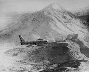 Acceleration: F-86 Sabre Jet against a rugged, snow covered