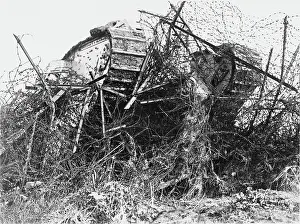 Barricades: F1 tank passing through barbed wire, WW1