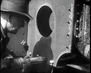 Constructing: A Factory Worker Constructing Part of a Ship