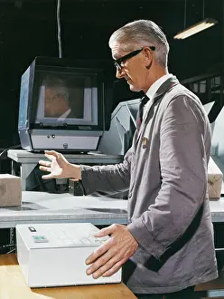 Fingernails: Factory worker operating control box
