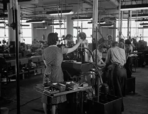 Grinding: Factory workers grinding V-blocks on machines, 1942