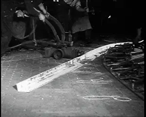 Shaping: Factory Workers Shaping Metal