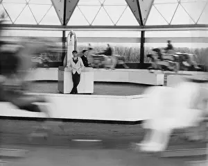 Stationary: Fairground ride with attendant at the centre