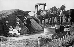 Homesteaders: Two families posing in front of an Oklahoma