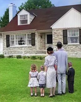 Homemaker: Family of Five with Backs To Camera on Lawn Looking