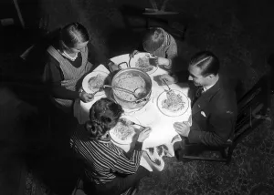 Charitable: Family eating stew