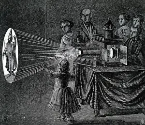 Lanterns: A family enjoying a magic lantern show
