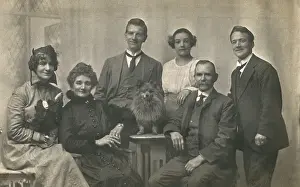 Lapdog: Family group studio portrait with small dog
