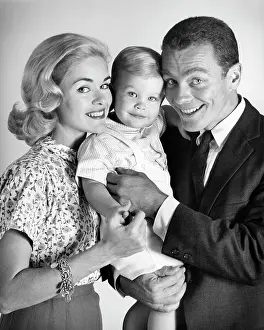 Overjoyed: Family of three looking at Camera