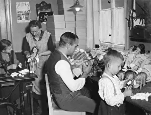 Housewife: Family making dolls, 1920