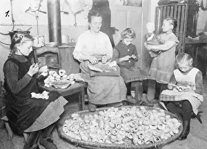 Decorate: Family making dolls, 1924