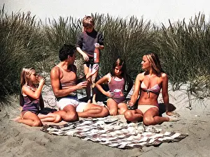 Andrew Besley: Family of five with picnic on beach