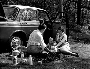 Calor: Family of three picnic by their car