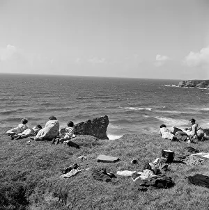 Outcrops: Family picnic on a cliff