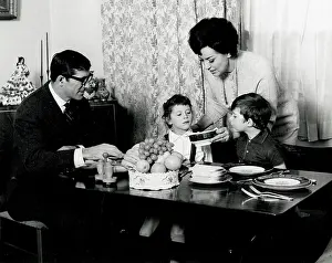 Dinnertime: Family seated at the dinner table 1960s