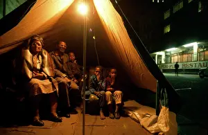 Squatter: Family sheltering in a tent. Some may have been