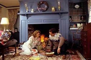 Bar007: Family sitting by fireplace