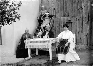 Granny: A Family Sitting at a Table