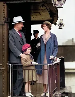 Parental: Family of Three Standing on Back Platform of Passenger