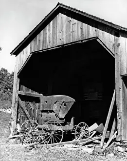 Cluttered: Farm Shed With Old Buggy