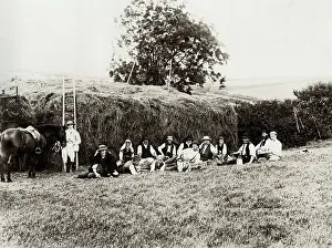Thatch: Farm workers resting beside a haystack, Somerset