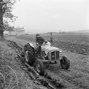 Fordson: Farmer Driving Tractor