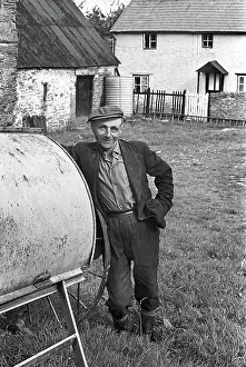 Herefordshire: Farmer in farmyard, Herefordshire