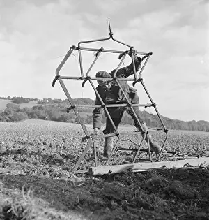 Harrowing: Farmer With Harrow