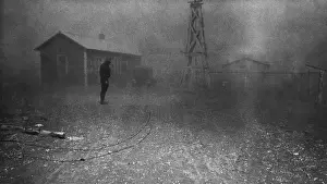 Lcgr1306: Farmer stands in a dust storm in New Mexico, Spring