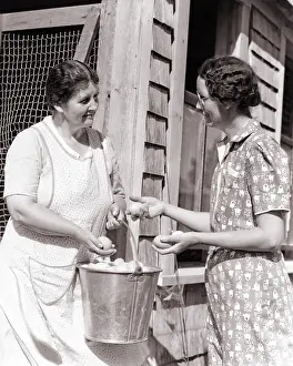Henhouse: Two farming women with eggs