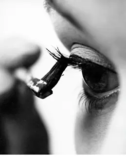 Applying: Fashion Model applying Mascara
